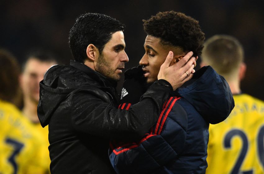 Arsenal's Spanish head coach Mikel Arteta (L) reacts with Arsenal's English midfielder Reiss Nelson at the final whistle during the English Premier League football match between Bournemouth and Arsenal at the Vitality Stadium in Bournemouth, southern England on December 26, 2019. (Photo by Glyn KIRK / AFP) / RESTRICTED TO EDITORIAL USE. No use with unauthorized audio, video, data, fixture lists, club/league logos or 'live' services. Online in-match use limited to 120 images. An additional 40 images may be used in extra time. No video emulation. Social media in-match use limited to 120 images. An additional 40 images may be used in extra time. No use in betting publications, games or single club/league/player publications. / (Photo by GLYN KIRK/AFP via Getty Images)
