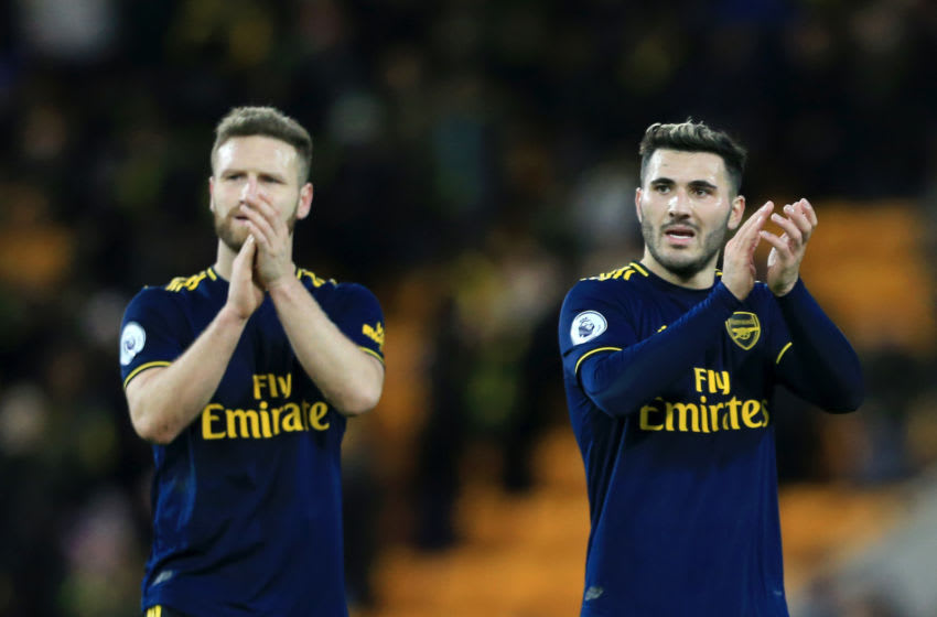 NORWICH, ENGLAND - DECEMBER 01: Sead Kolasinac of Arsenal and Shkodran Mustafi of Arsenal acknowledge the fans during the Premier League match between Norwich City and Arsenal FC at Carrow Road on December 01, 2019 in Norwich, United Kingdom. (Photo by Stephen Pond/Getty Images)