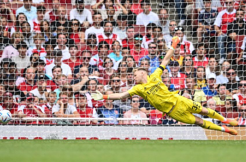 Arsenal's English goalkeeper Aaron Ramsdale dives for the ball during a club friendly football match between Arsenal and Sevilla at the Emirates Stadium in London on July 30, 2022. (Photo by JUSTIN TALLIS / AFP) (Photo by JUSTIN TALLIS/AFP via Getty Images)
