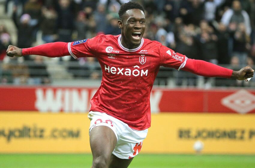 Reims' English forward Folarin Balogun celebrates scoring a goal during the French L1 football match between Stade de Reims and Stade Rennais FC at the Auguste-Delaune II stadium in Reims on December 29, 2022. (Photo by FRANCOIS NASCIMBENI / AFP) (Photo by FRANCOIS NASCIMBENI/AFP via Getty Images)