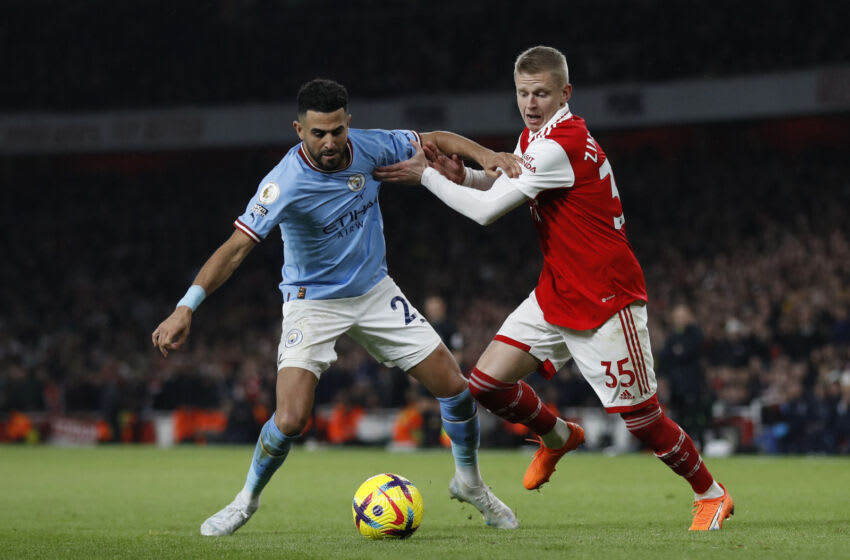 Manchester City's Algerian midfielder Riyad Mahrez (L) fights for the ball with Arsenal's Ukrainian defender Oleksandr Zinchenko during the English Premier League football match between Arsenal and Manchester City at the Emirates Stadium in London on February 15, 2023. - - RESTRICTED TO EDITORIAL USE. No use with unauthorized audio, video, data, fixture lists, club/league logos or 'live' services. Online in-match use limited to 120 images. An additional 40 images may be used in extra time. No video emulation. Social media in-match use limited to 120 images. An additional 40 images may be used in extra time. No use in betting publications, games or single club/league/player publications. (Photo by Ian Kington / IKIMAGES / AFP) / RESTRICTED TO EDITORIAL USE. No use with unauthorized audio, video, data, fixture lists, club/league logos or 'live' services. Online in-match use limited to 120 images. An additional 40 images may be used in extra time. No video emulation. Social media in-match use limited to 120 images. An additional 40 images may be used in extra time. No use in betting publications, games or single club/league/player publications. / RESTRICTED TO EDITORIAL USE. No use with unauthorized audio, video, data, fixture lists, club/league logos or 'live' services. Online in-match use limited to 120 images. An additional 40 images may be used in extra time. No video emulation. Social media in-match use limited to 120 images. An additional 40 images may be used in extra time. No use in betting publications, games or single club/league/player publications. (Photo by IAN KINGTON/IKIMAGES/AFP via Getty Images)