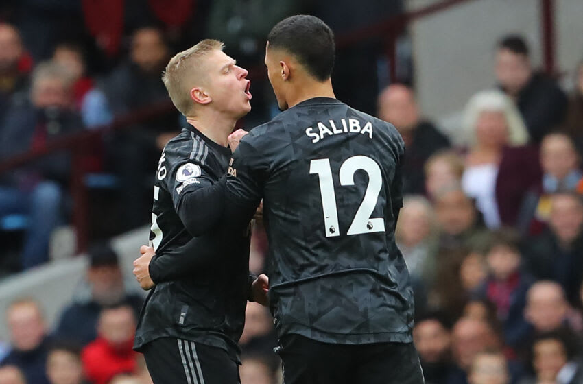 Arsenal's Ukrainian defender Oleksandr Zinchenko (L) celebrates with Arsenal's French defender William Saliba (R) after scoring their second goal during the English Premier League football match between Aston Villa and Arsenal at Villa Park in Birmingham, central England on February 18, 2023. - RESTRICTED TO EDITORIAL USE. No use with unauthorized audio, video, data, fixture lists, club/league logos or 'live' services. Online in-match use limited to 120 images. An additional 40 images may be used in extra time. No video emulation. Social media in-match use limited to 120 images. An additional 40 images may be used in extra time. No use in betting publications, games or single club/league/player publications. (Photo by Geoff Caddick / AFP) / RESTRICTED TO EDITORIAL USE. No use with unauthorized audio, video, data, fixture lists, club/league logos or 'live' services. Online in-match use limited to 120 images. An additional 40 images may be used in extra time. No video emulation. Social media in-match use limited to 120 images. An additional 40 images may be used in extra time. No use in betting publications, games or single club/league/player publications. / RESTRICTED TO EDITORIAL USE. No use with unauthorized audio, video, data, fixture lists, club/league logos or 'live' services. Online in-match use limited to 120 images. An additional 40 images may be used in extra time. No video emulation. Social media in-match use limited to 120 images. An additional 40 images may be used in extra time. No use in betting publications, games or single club/league/player publications. (Photo by GEOFF CADDICK/AFP via Getty Images)