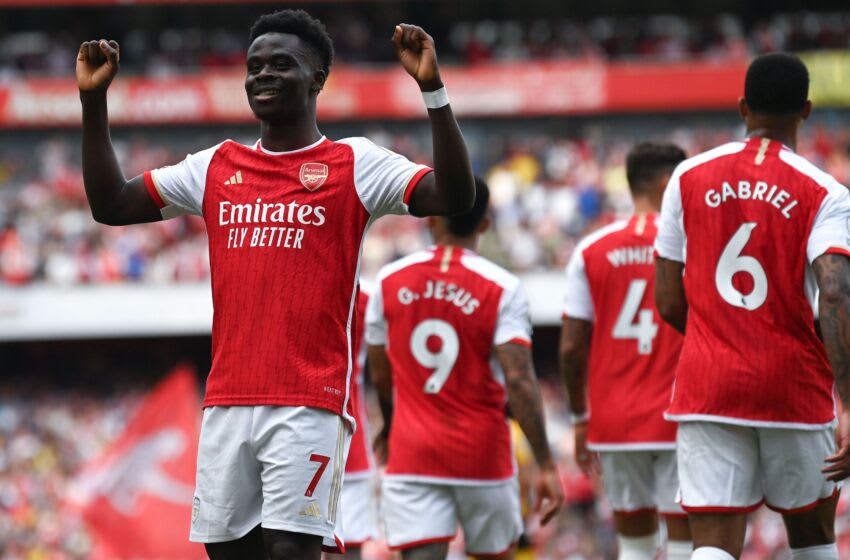Arsenal's English midfielder Bukayo Saka celebrates after scoring his team's third goal during the English Premier League football match between Arsenal and Wolverhampton Wanderers at the Emirates Stadium in London on May 28, 2023. (Photo by Glyn KIRK / AFP) / RESTRICTED TO EDITORIAL USE. No use with unauthorized audio, video, data, fixture lists, club/league logos or 'live' services. Online in-match use limited to 120 images. An additional 40 images may be used in extra time. No video emulation. Social media in-match use limited to 120 images. An additional 40 images may be used in extra time. No use in betting publications, games or single club/league/player publications. / (Photo by GLYN KIRK/AFP via Getty Images)