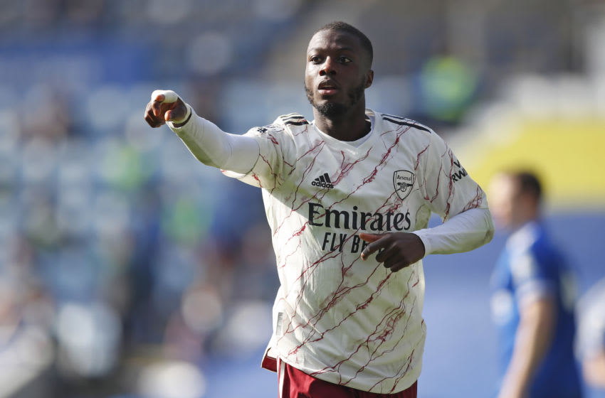 LEICESTER, ENGLAND - FEBRUARY 28: Nicolas Pepe ofArsenal reacts during the Premier League match between Leicester City and Arsenal at The King Power Stadium on February 28, 2021 in Leicester, England. Sporting stadiums around the UK remain under strict restrictions due to the Coronavirus Pandemic as Government social distancing laws prohibit fans inside venues resulting in games being played behind closed doors. (Photo by Malcolm Couzens/Getty Images)