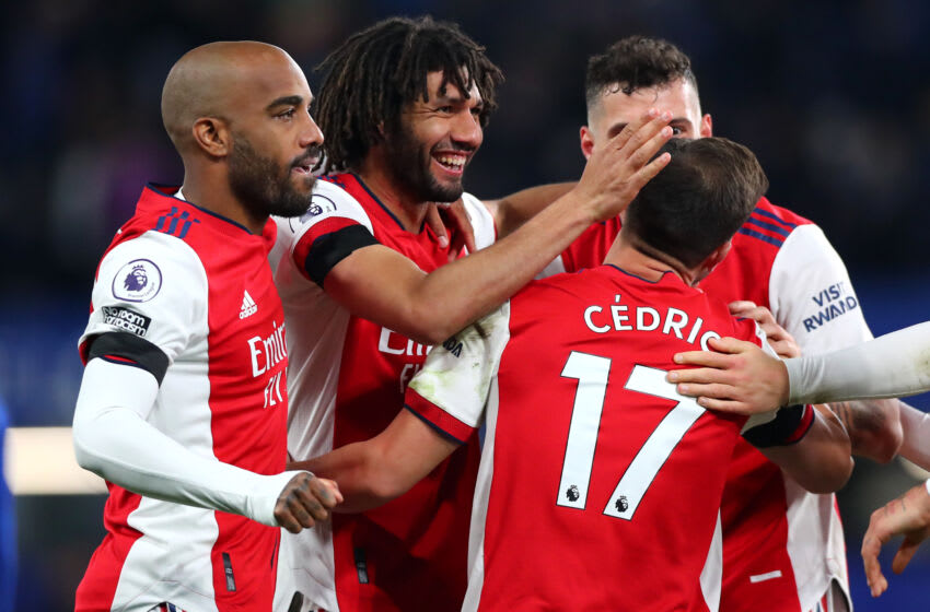 LONDON, ENGLAND - APRIL 20: Alexandre Lacazette, Mohamed Elneny of Arsenal and Cedric Soares of Arsenal celebrate at full time during the Premier League match between Chelsea and Arsenal at Stamford Bridge on April 20, 2022 in London, England. (Photo by Chloe Knott - Danehouse/Getty Images)