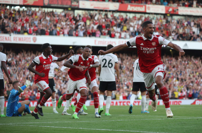 LONDON, ENGLAND - AUGUST 27: William Saliba of Arsenal celebrates the goal of Gabriel Magalhaes of Arsenal during their sides second goal with team mates during the Premier League match between Arsenal FC and Fulham FC at Emirates Stadium on August 27, 2022 in London, England. (Photo by Eddie Keogh/Getty Images)