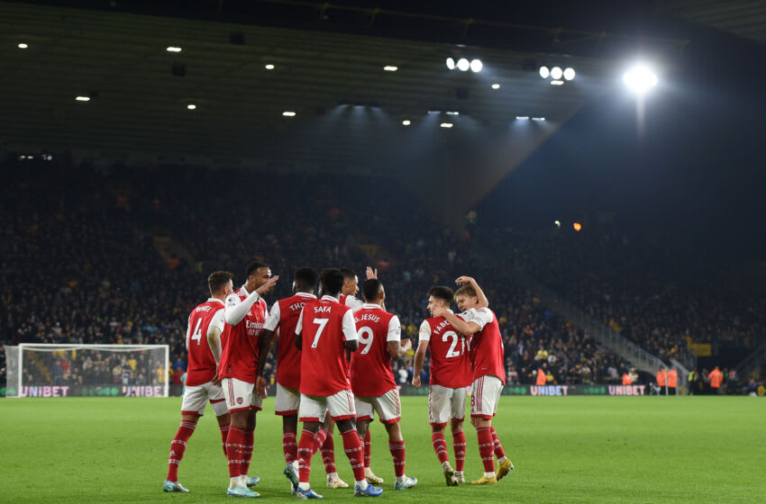 WOLVERHAMPTON, ENGLAND - NOVEMBER 12: Martin Odegaard of Arsenal celebrates with teammate Fabio Vieira after scoring his team's first goal during the Premier League match between Wolverhampton Wanderers and Arsenal FC at Molineux on November 12, 2022 in Wolverhampton, England. (Photo by Harriet Lander/Getty Images)