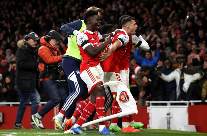 LONDON, ENGLAND - DECEMBER 26: Gabriel Martinelli of Arsenal celebrates with teammates Bukayo Saka and Granit Xhaka after scoring their side's second goal during the Premier League match between Arsenal FC and West Ham United at Emirates Stadium on December 26, 2022 in London, England. (Photo by Alex Pantling/Getty Images)