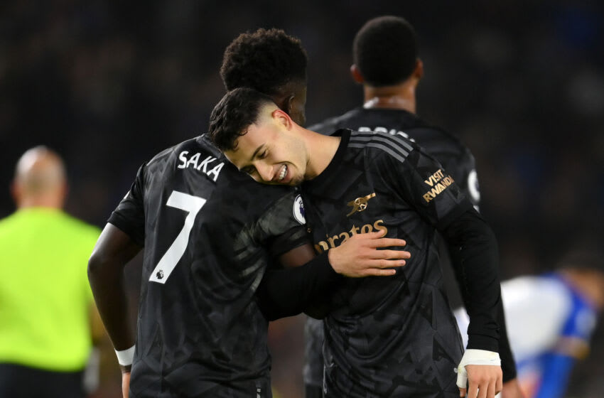 BRIGHTON, ENGLAND - DECEMBER 31: Gabriel Martinelli of Arsenal celebrates with teammate Bukayo Saka after scoring the team's fourth goal during the Premier League match between Brighton & Hove Albion and Arsenal FC at American Express Community Stadium on December 31, 2022 in Brighton, England. (Photo by Mike Hewitt/Getty Images)