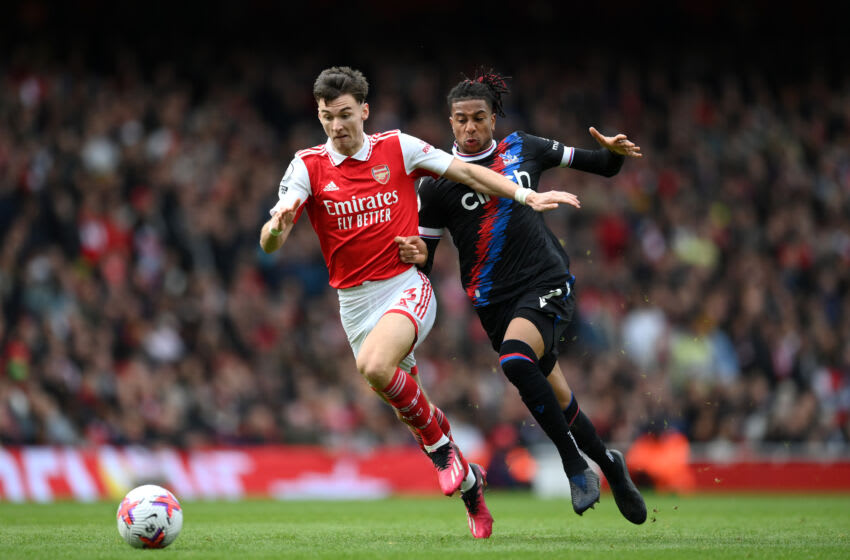 LONDON, ENGLAND - MARCH 19: Kieran Tierney of Arsenal is challenged by Michael Olise of Crystal Palace during the Premier League match between Arsenal FC and Crystal Palace at Emirates Stadium on March 19, 2023 in London, England. (Photo by Shaun Botterill/Getty Images)