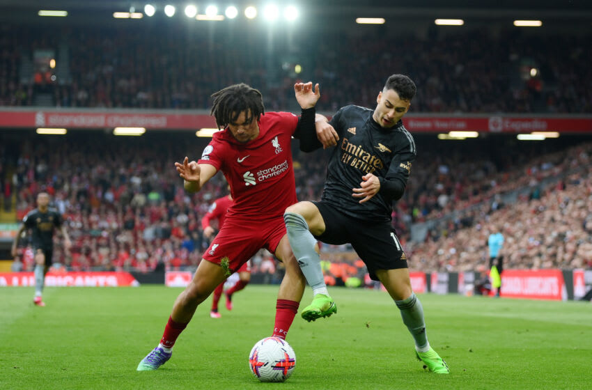 LIVERPOOL, ENGLAND - APRIL 09: Trent Alexander-Arnold of Liverpool challenges Gabriel Martinelli of Arsenal during the Premier League match between Liverpool FC and Arsenal FC at Anfield on April 09, 2023 in Liverpool, England. (Photo by Shaun Botterill/Getty Images)