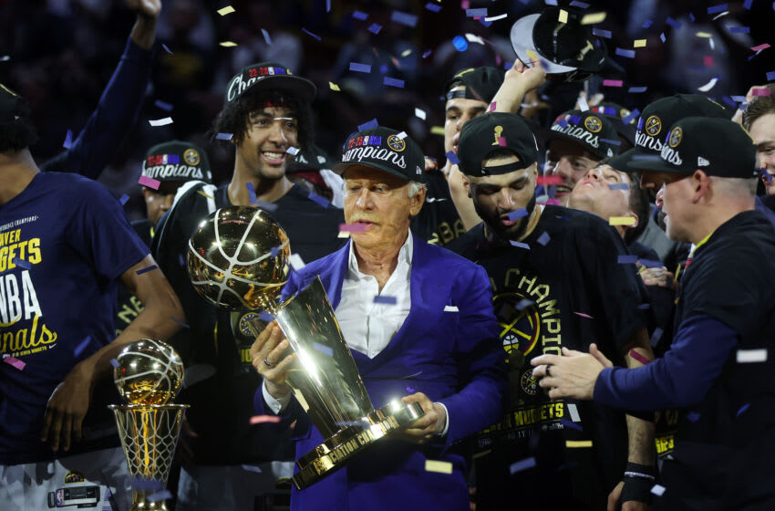DENVER, COLORADO - JUNE 12: Denver Nuggets owner Stan Kroenke raises the Larry O'Brien Championship Trophy after a 94-89 victory against the Miami Heat in Game Five of the 2023 NBA Finals to win the NBA Championship at Ball Arena on June 12, 2023 in Denver, Colorado. NOTE TO USER: User expressly acknowledges and agrees that, by downloading and or using this photograph, User is consenting to the terms and conditions of the Getty Images License Agreement. (Photo by Matthew Stockman/Getty Images)